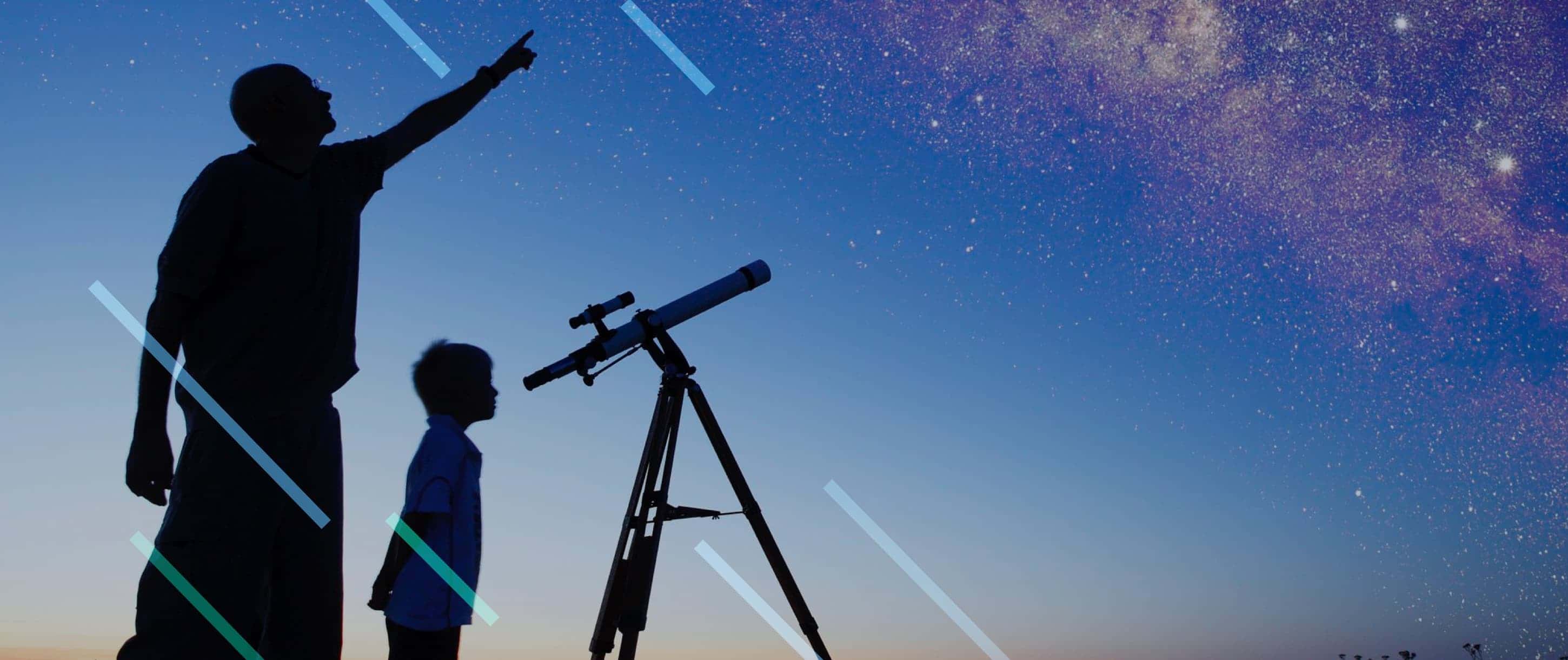 Morehead Planetaium man and boy looking at stars with telescope