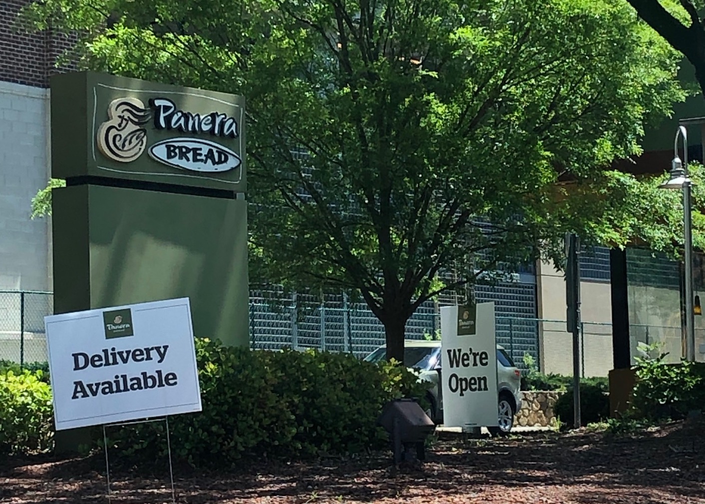 Panera Bread Restaurant with sign for Delivery Available