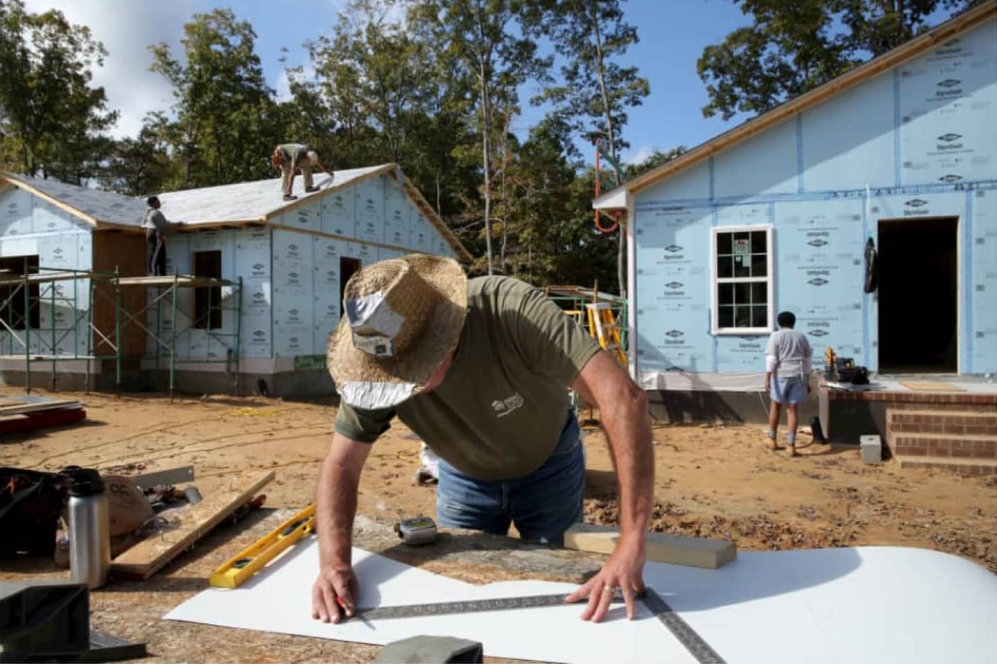 Man working at Habitat home building location