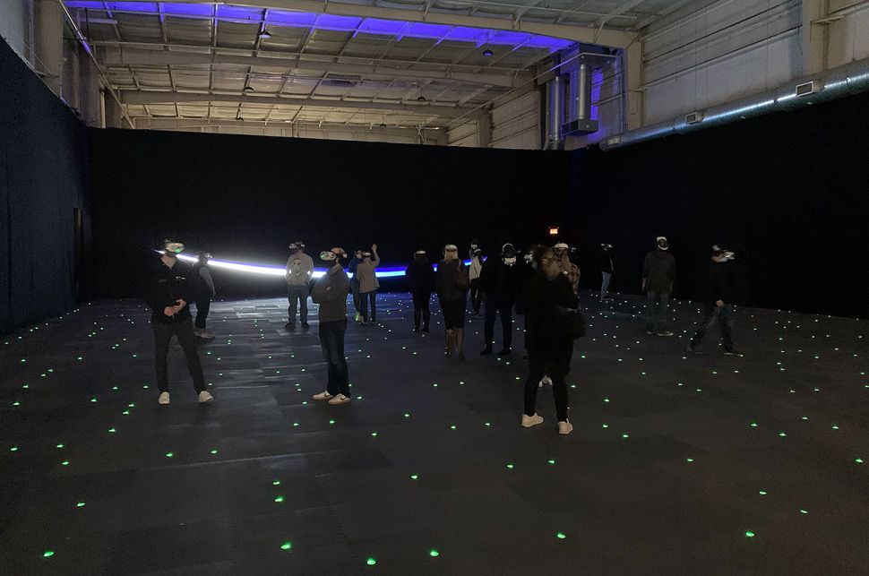 group of people in fully immersive VR room